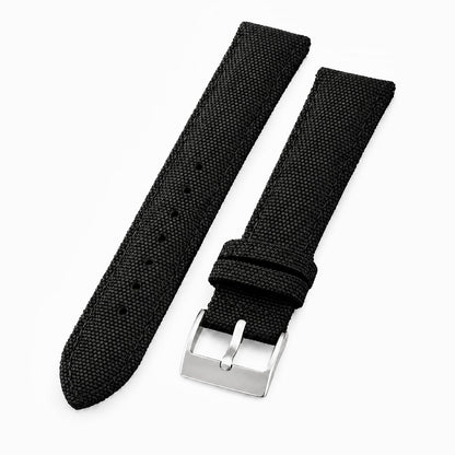 Black sailcloth watch strap with quick-release spring bars and stainless steel buckle.